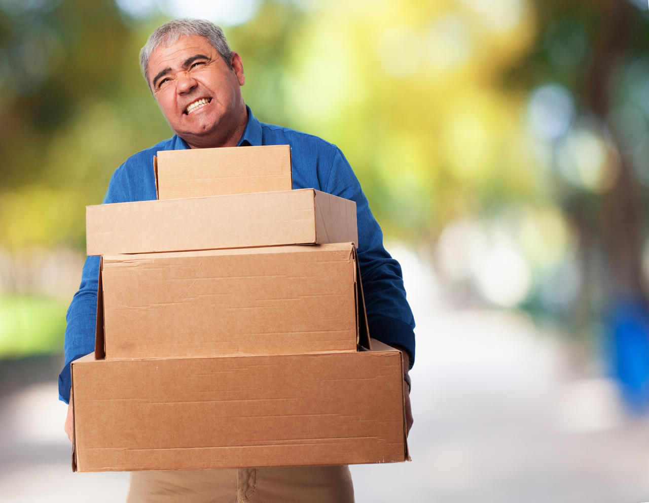 man with heavy boxes
