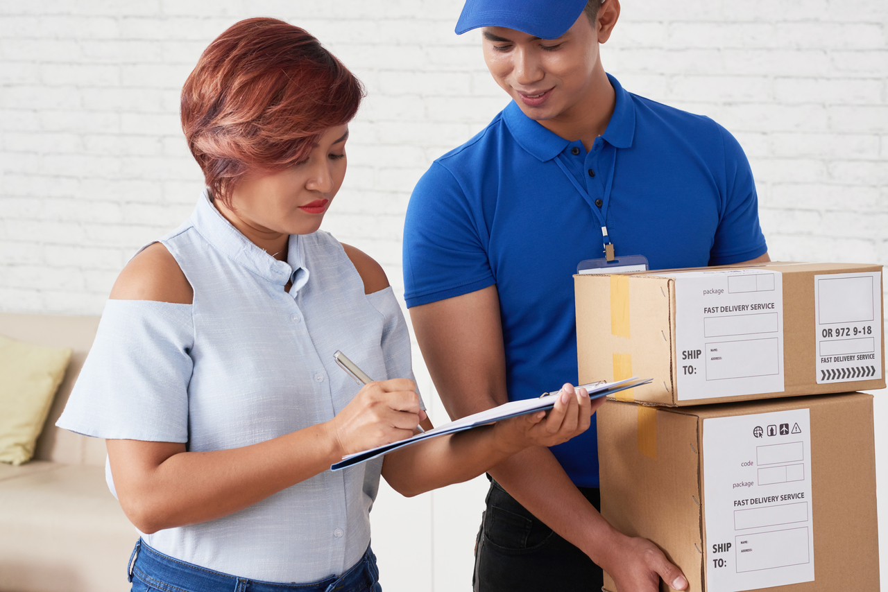 Woman signing document when receiving order