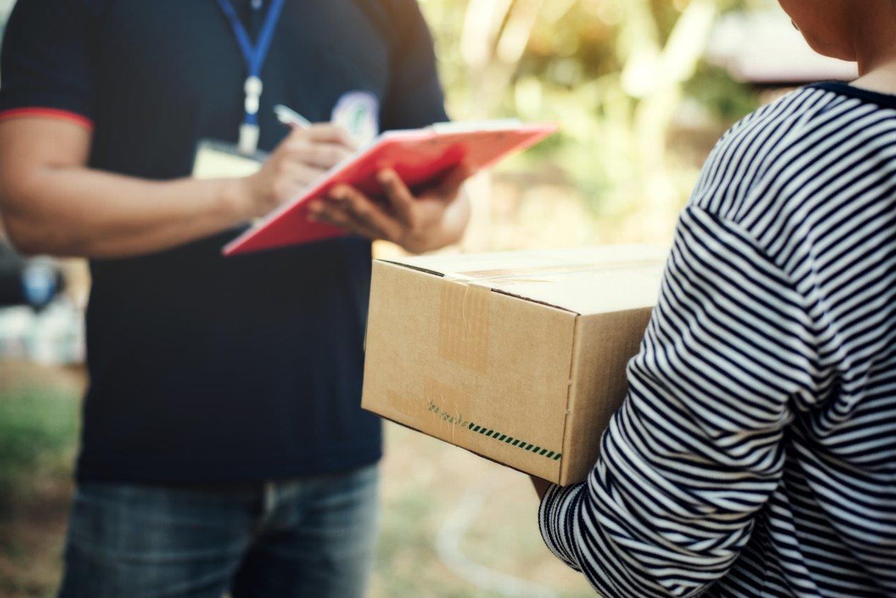 woman receiving package from man