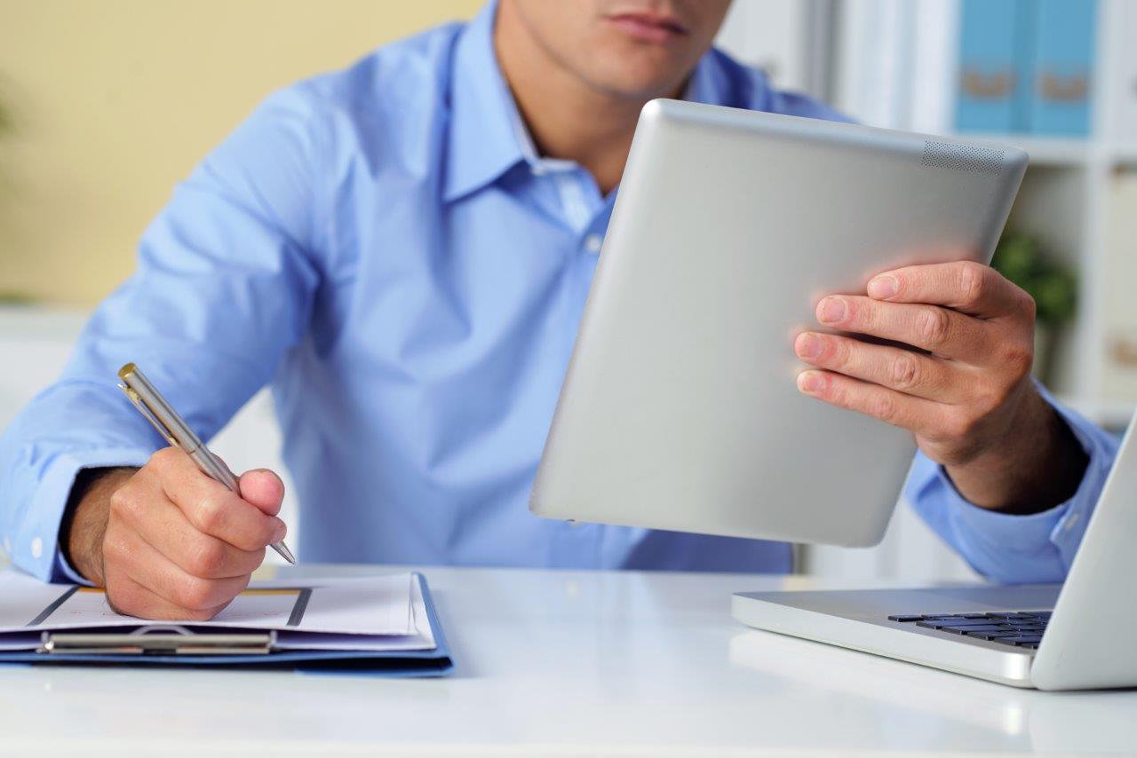 man checking notes