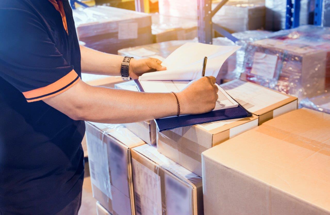 man inspecting inventory