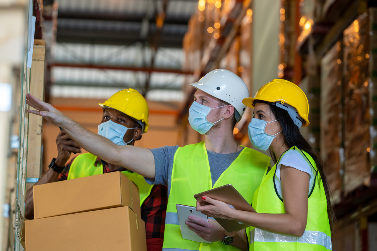 A businessman coordinating with his suppliers